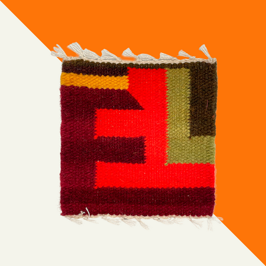 Handcrafted textile coasters in vibrant hues, using natural dyes and ethical materials.