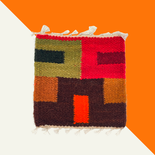 Colorful wool coasters, ethically sourced and hand-dyed using traditional Peruvian techniques.
