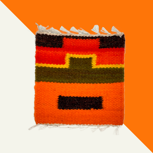 Handwoven Peruvian wool coasters with bold natural colors and traditional patterns.