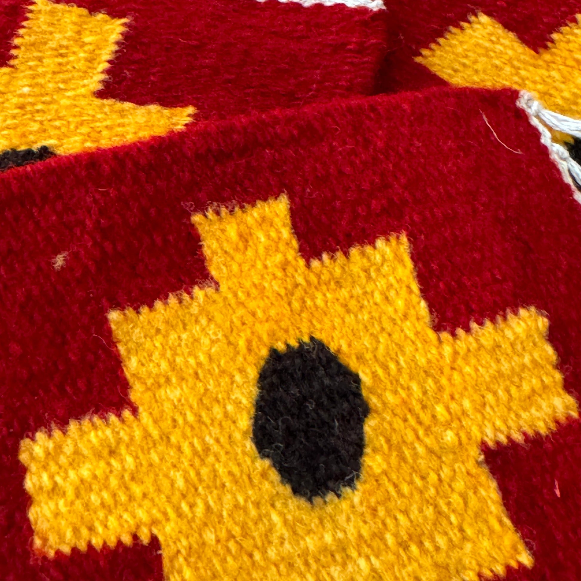 close up of colorful set of eco-friendly textile coasters, handmade from Peruvian sheep’s wool