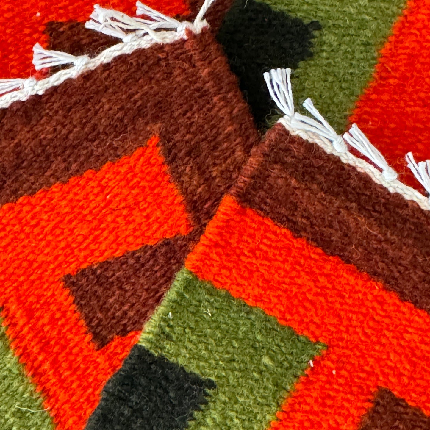 Sustainably made Peruvian wool coasters featuring geometric designs and eco-friendly dyes.