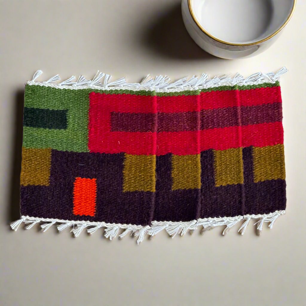 Handcrafted textile coasters with natural wool and earthy tones, perfect for eco-conscious decor