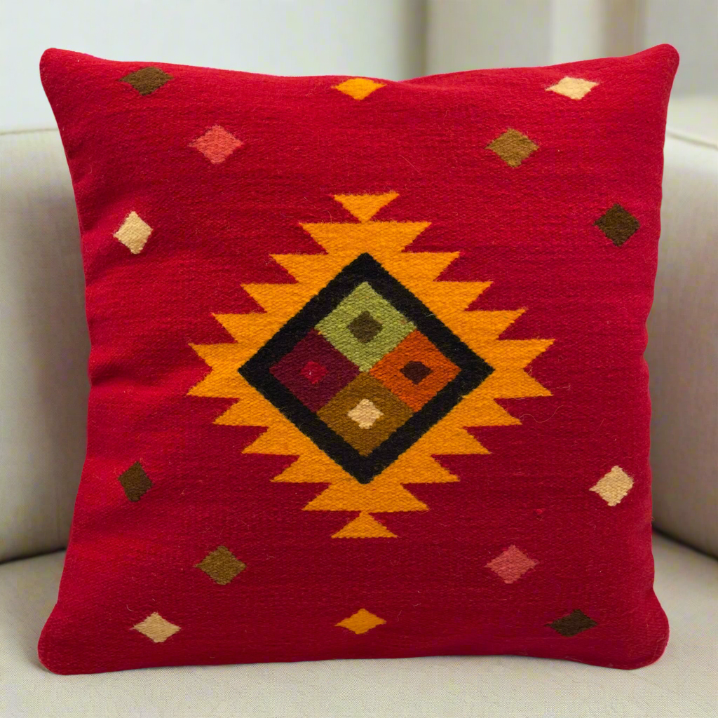 Rustic handwoven cushion cover with bold natural dye accents and Peruvian wool craftsmanship